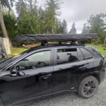 Trail Lite roof tent mounted on a vehicle, offering compact and durable camping solution for overland adventures.