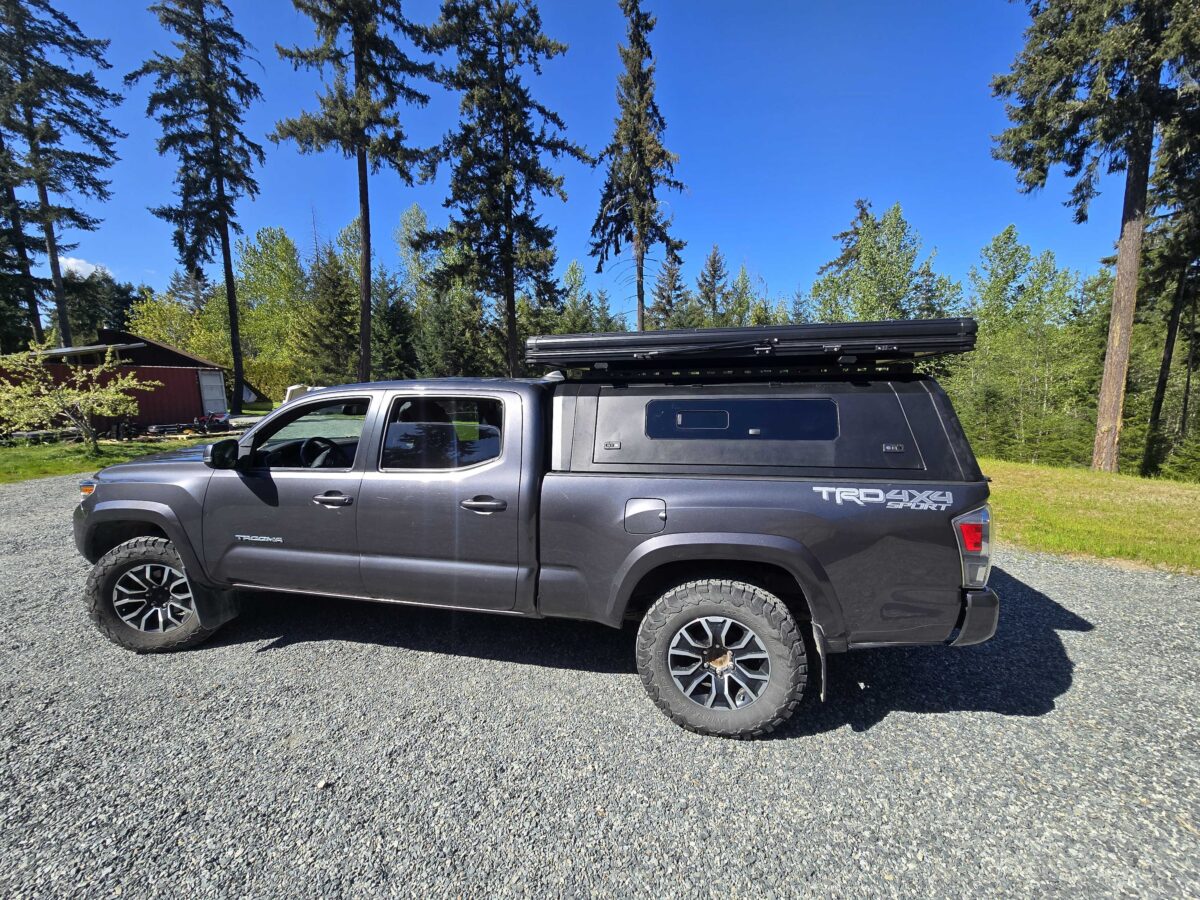 Toyota Tacoma 2016–2023 canopy installed on truck bed with durable aluminum construction for overland and utility use