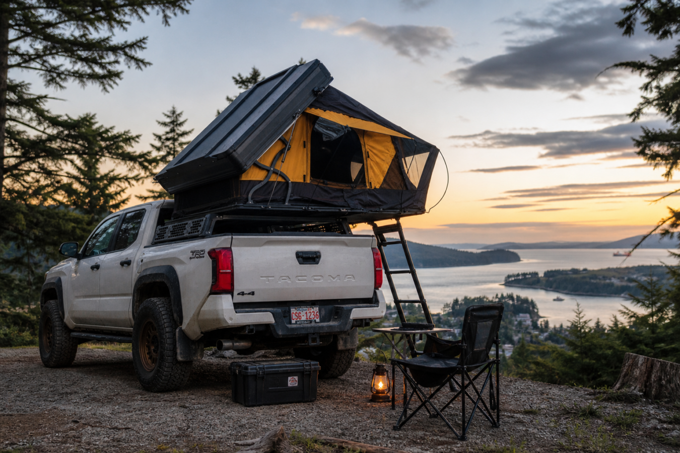 Overlanding truck with rooftop tent camping above Nanaimo coastline at sunrise, Vancouver Island British Columbia Canada